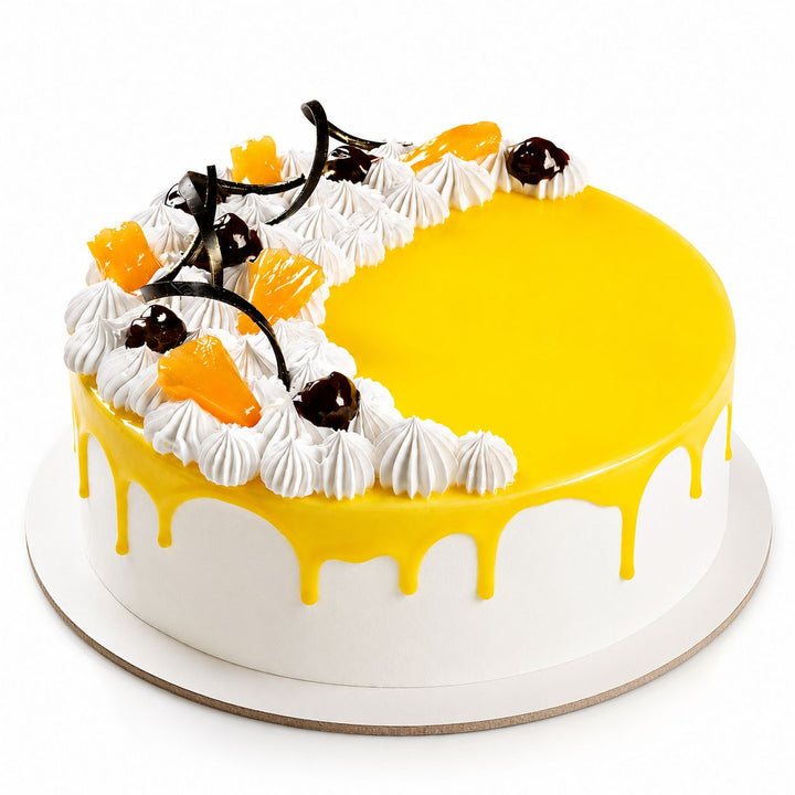 Mango Cake
Eggless mango cake with smooth white cream finish, glossy yellow mango glaze drip, piped cream rosettes, fresh mango pieces, dark cherries and chocolate curl decorations , 
freshly baked and available to order online at Pam's Bakery, Sector 75, Spectrum Metro Mall, Noida